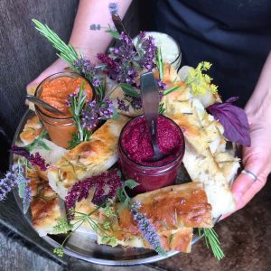 dips and focaccia witht edible flowers